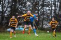Stonehaven's Ross Mitchell up for a header against Hermes. Image: Kath Flannery/DC Thomson