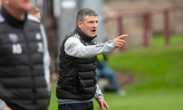 Shane Sutherland celebrates scoring for Brora Rangers against Cumnock in the Scottish Cup. Pictures by Jasperimage.