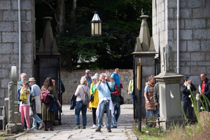 Tourists - like these at St Machar Cathedral in Aberdeen - could soon be taxed for staying in Granite City hotels overnight. Image: Kami Thomson/DC Thomson