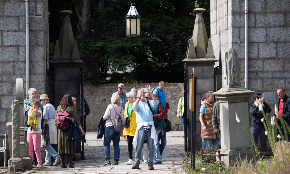 Tourists at St Machar Cathedral in Aberdeen.