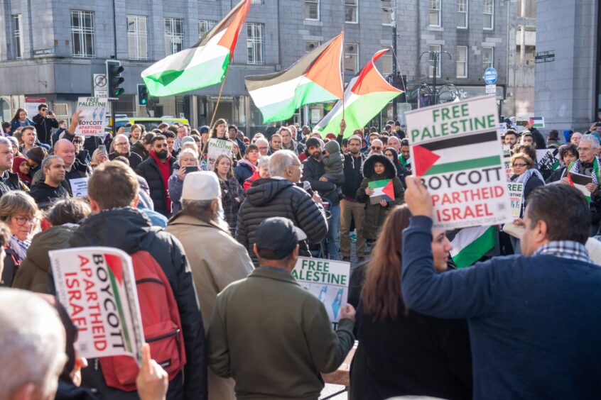 Protesters brought Palestinian flags to the rally along with signs that read: 'Boycott apartheid Israel'.