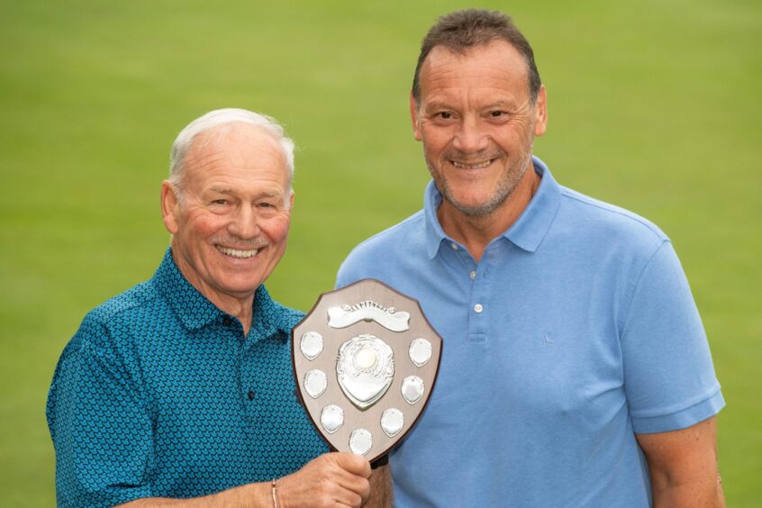 Peter Mutch of sponsor Aberdein Considine with the winner of the 2023 Evening Express Champion of Champions senior gents' handicap, Jim Coutts