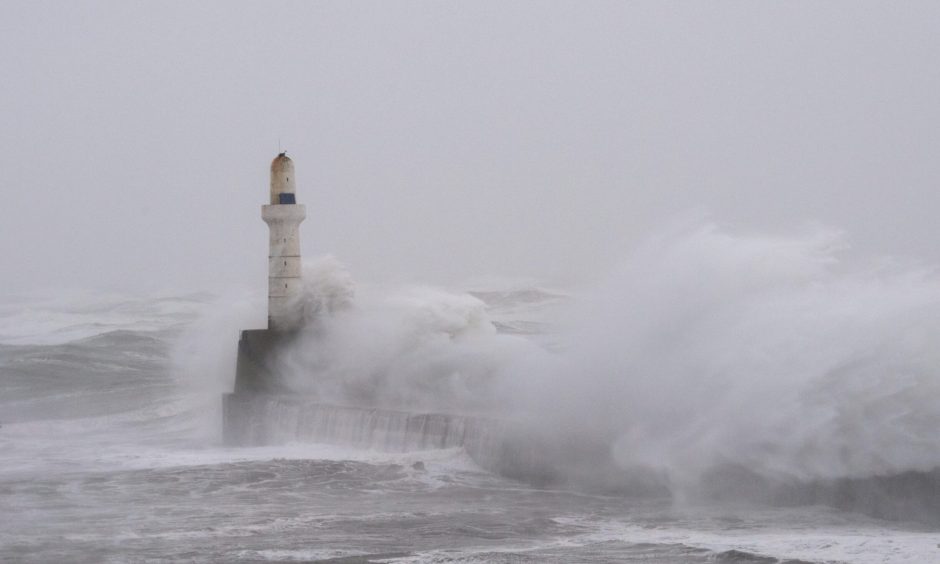 Waves crash against Aberdeen Beach.