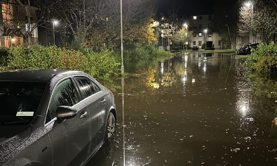 Car in Peterculter floods.