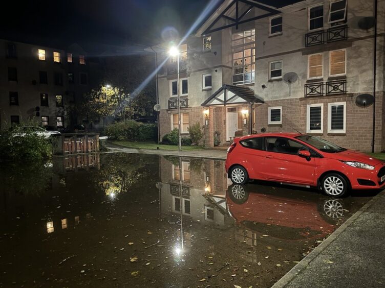 Flooding outside flats in Peterculter.