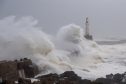 Huge waves crash at Aberdeen Beach as the city is hit by Storm Babet.