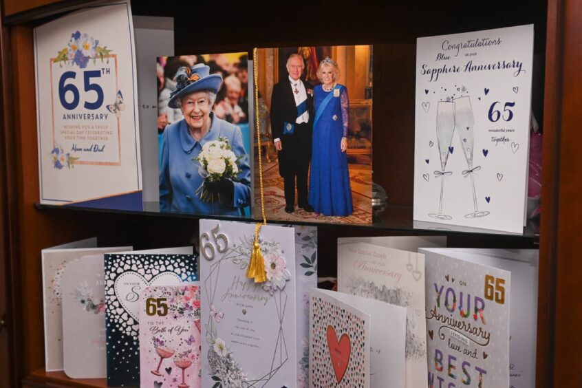 Anniversary cards from the Royal monarchs stand amidst an outpouring of well wishes from friends and family. 