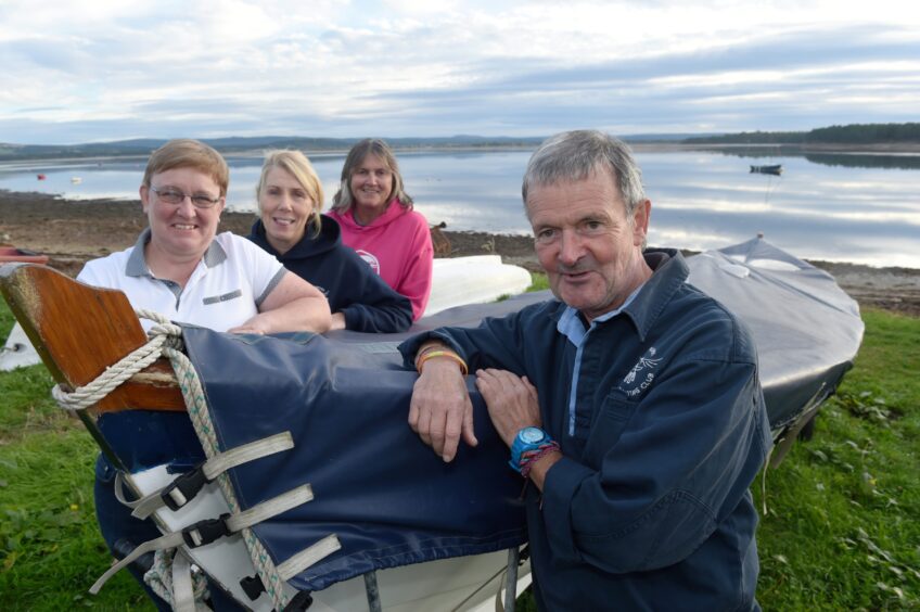 Maclean Macleod of Findhorn with three fellow members of the Findhorn Coastal Rowing Club who saved his life after a cardiac arrest on the boat.