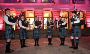 Renfrewshire School Pipe Band play outside Paisley Abbey and Town Hall. Image: Sandy McCook/DC Thomson