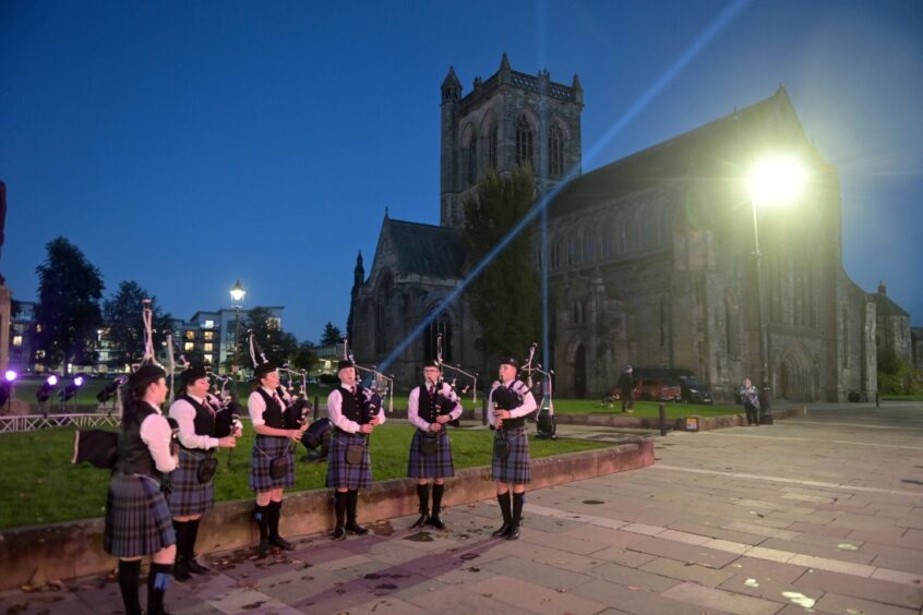 Renfrewshire Schools Pipe Band play outside Paisley Abbey and Town Hall welcoming guests to the opening concert in the Town Hall.
