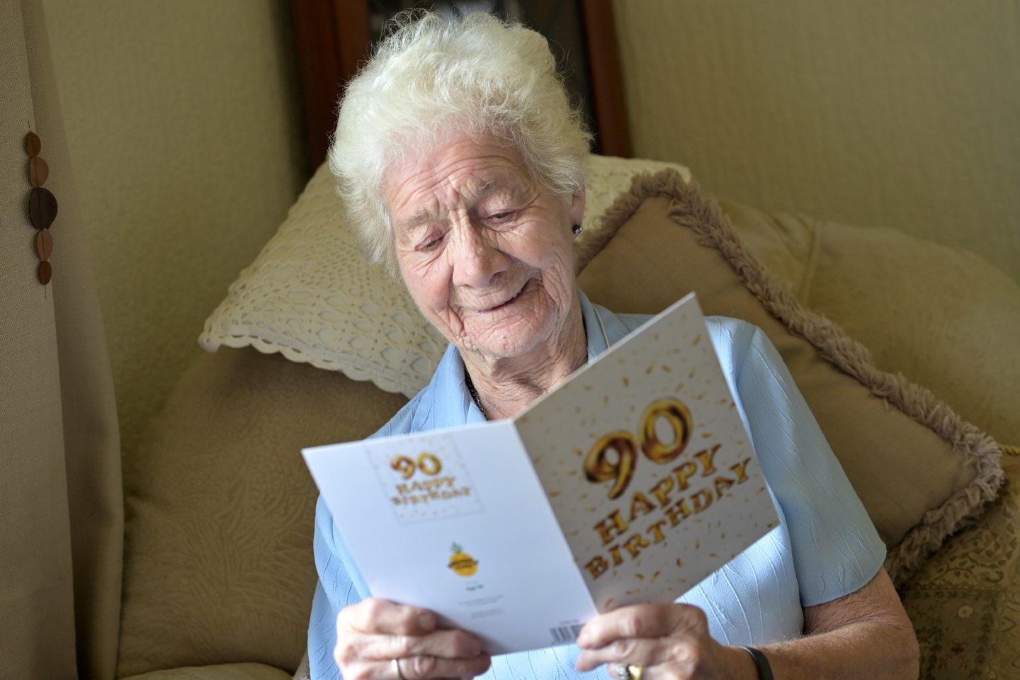 Elma O'Rourke, highland dementia sufferer, holding a 90th birthday card