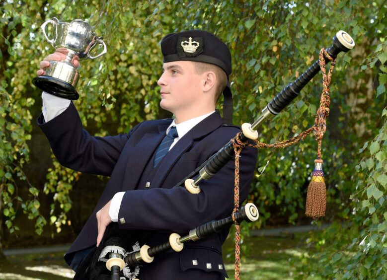 Arran Green of Bannpockburn High School with the Royal Highland Fusiliers Cup for 2/4 March, Strathspey and Reel in the 16-18 age category. 