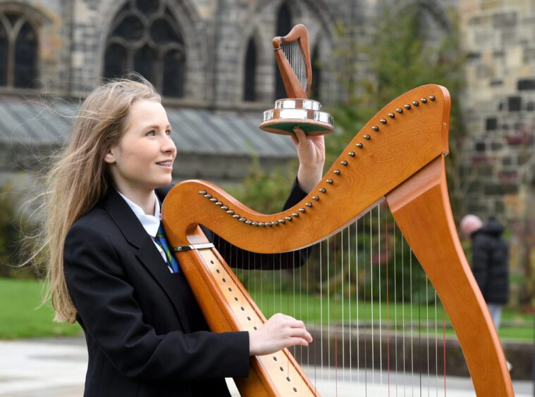 Lily, pictured outside Paisley Abbey, began learning the Clarsach at the age of seven.