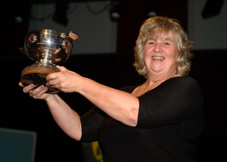 Conductor Riona Whyte with the Sheriff MacMaster Campbell Memorial Quaich.