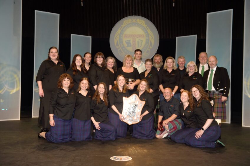 Riona Whyte, conductor of Burach with the Sheriff MacMaster Campbell Memorial Quaich and the Selma Shield for the highest marks in Gaelic.