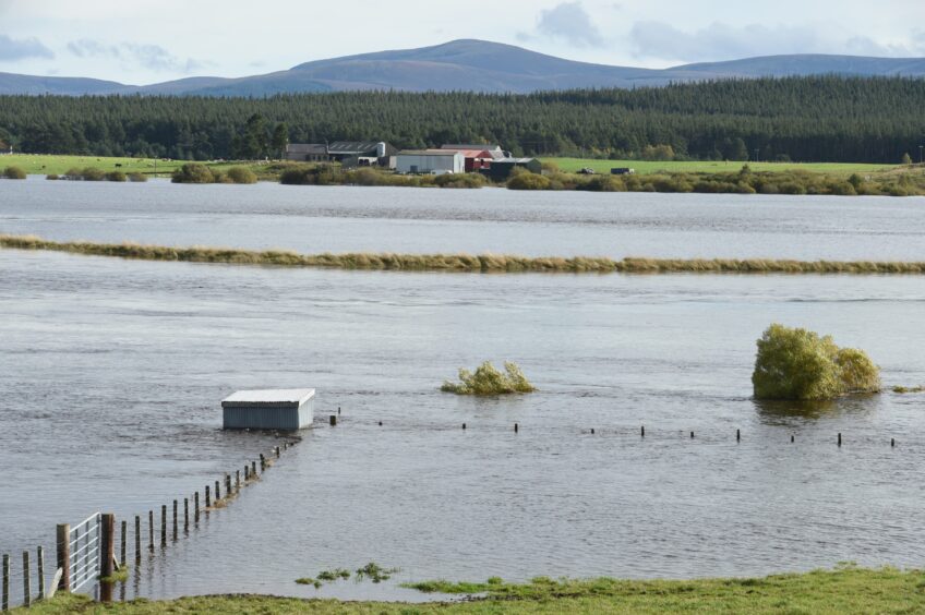 Flood water swamps fields surrounding Nethy Bridge.