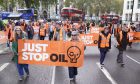 Just Stop Oil activists demonstrate in Parliament Square, London.