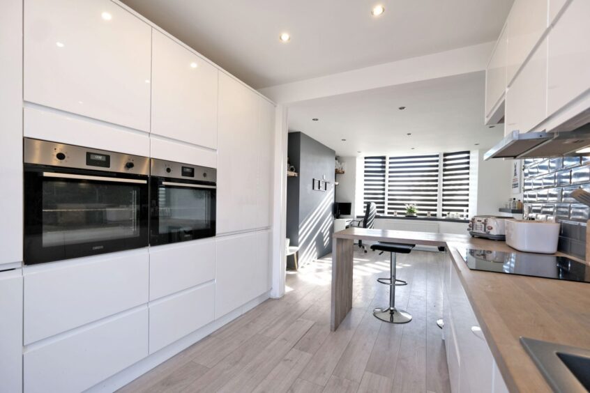 Open plan kitchen and dining area within the house for sale in Aberdeen.