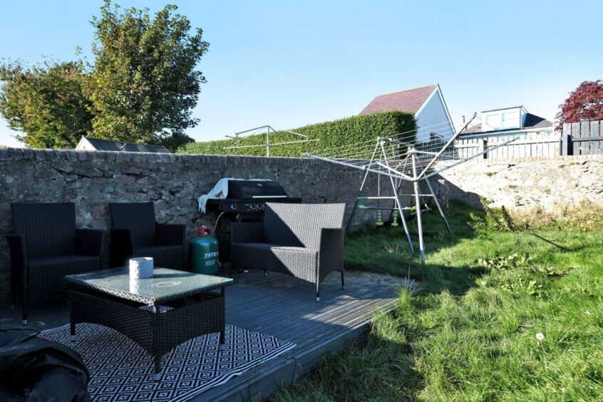 The outdoor decking and seating area of the 4-bedroom house for sale in Aberdeen.