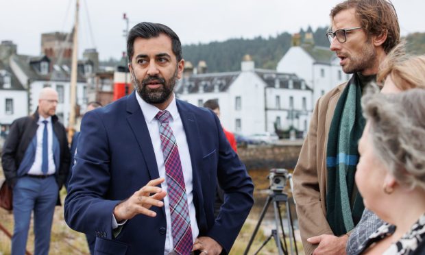 First Minister Humza Yousaf speaks to members of the public at Inveraray harbour. Image: PA