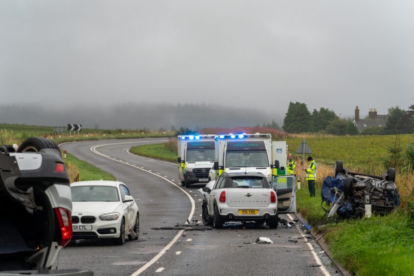 The scene of the four-car crash caused by the Elgin Driver on the A98, with two ambulances at the scene