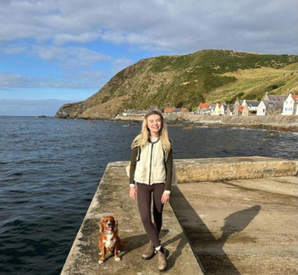 Georgia Toffolo, with her dog, pictured in Gardenstown.