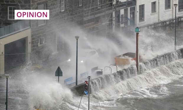 High waves hit Stonehaven during Storm Babet. The town was protected by its flood defences (Image: Andrew Milligan/PA Wire)