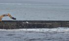 The North Pier at Aberdeen Harbour was damaged by Storm Babet. Image from reader John Walker