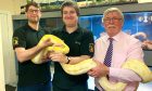 José Silver and Chris Evans from SEAR with George Maclean from Neacreath Ltd and Sam, a Burmese python