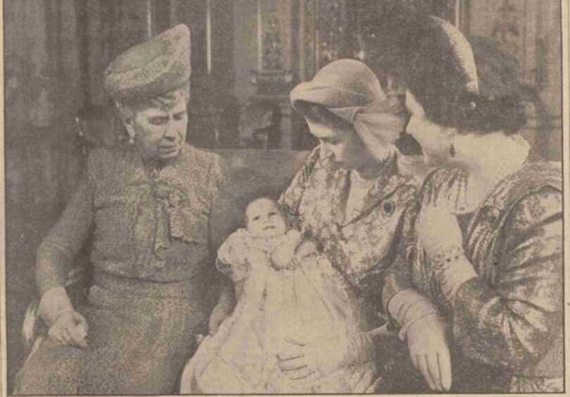 Anne is held by her mother Princess Elizabeth her grandmother, and her great-grandmother Queen Mary.
