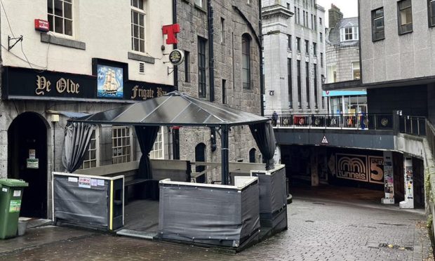 Exterior of Ye Olde Frigate Bar with outdoor seating area