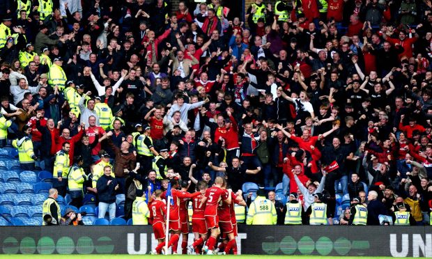 Aberdeen fans celebrating Jack MacKenzie's goal against Rangers