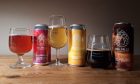 Three beers in glasses, alongside their cans, from Inverness Brewery Dog Falls.