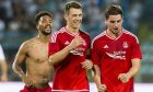 Aberdeen's (L/R) Shay Logan. Ryan Jack and Kenny McLean celebrate at full-time after beating HJK Rijeka 3-0. Image: SNS