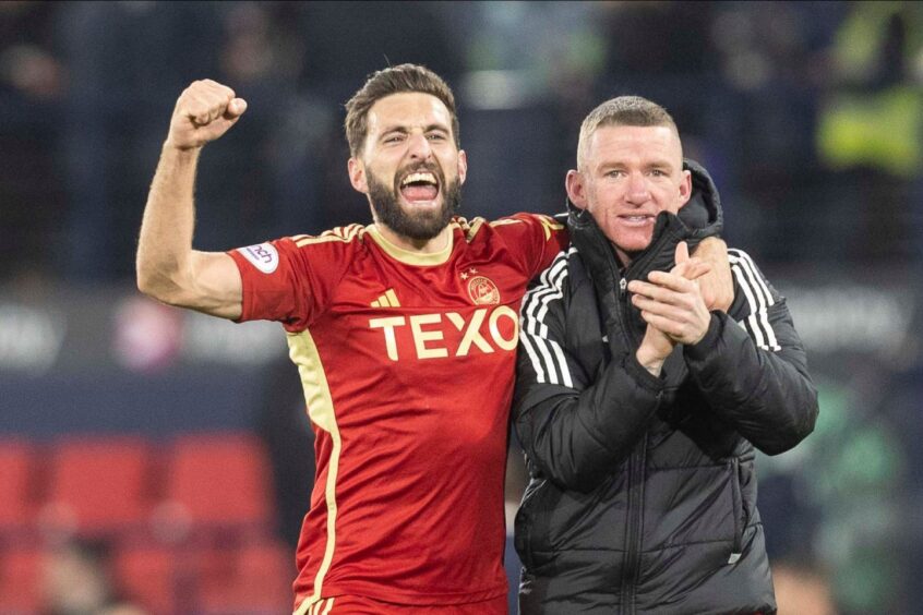 Aberdeen captain Graeme Shinnie and Jonny Hayes celebrate after beating Hibs 1-0 in the Viaplay Cup semi-final at Hampden. Image: Shutterstock