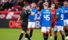 Referee Nick Walsh blows his whistle before going to the VAR monitor to check for a possible penalty kick to Rangers against Aberdeen. Image: Shutterstock.