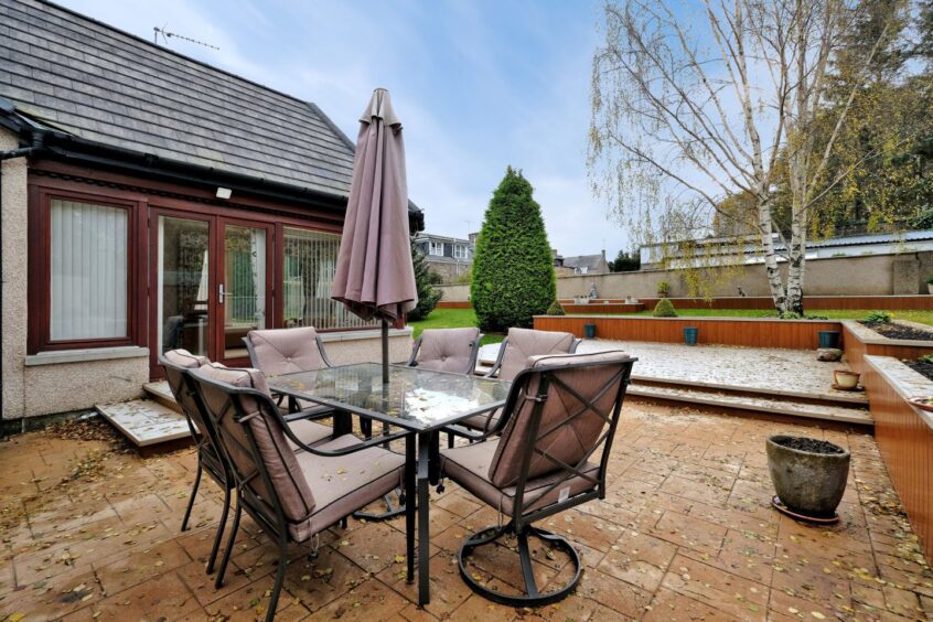 Spacious patio area behind the Aberdeenshire home.