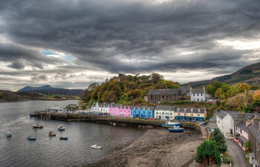 Portree colourful houses in with a stormy grey sky