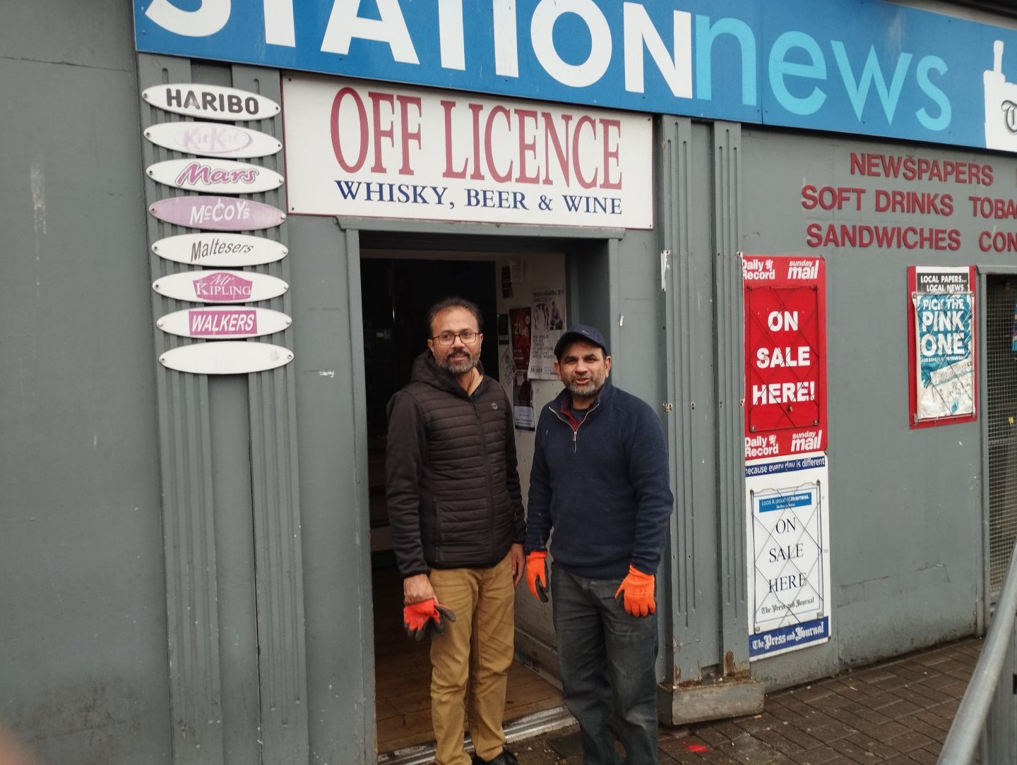 Owner Munawar Ahmad outside Station News with employee Omar Aziz.