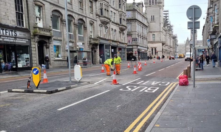 Council workers adding new road markings