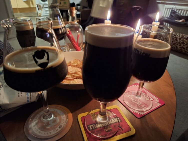 Three glasses full of the three stouts being reviewed in this article. 