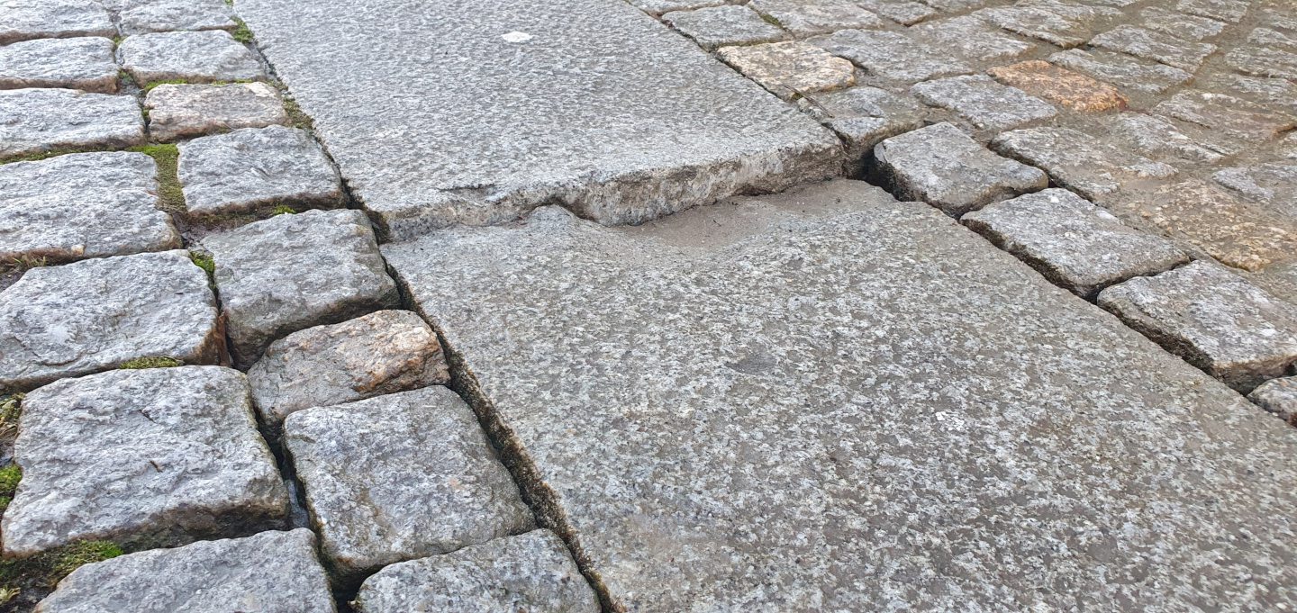 Broken stones on Elgin High Street. 