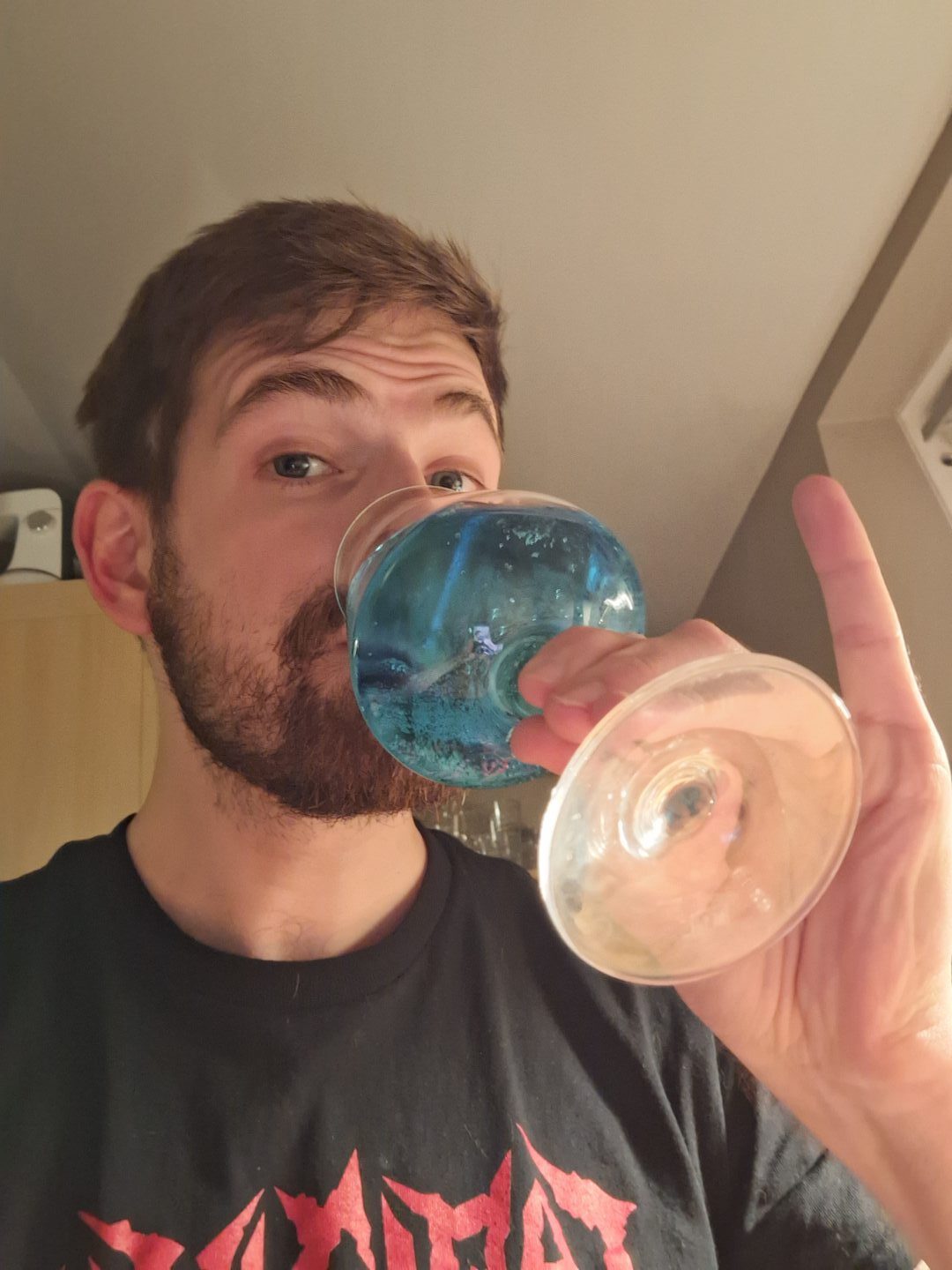 The writer drinking WKD Blue with his pinky out. 