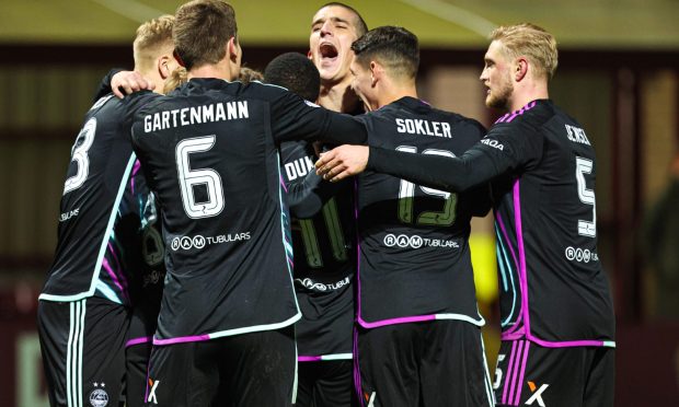 Aberdeen players celebrate after Luis Lopes scores to make it 4-0 against Motherwell. Image: SNS.