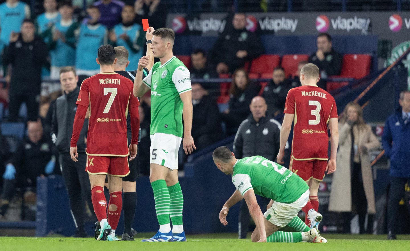 Aberdeen's Jack MacKenzie is shown a red card by the Referee