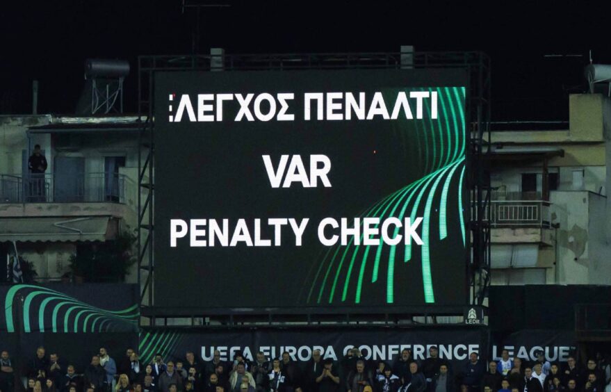 Screen at PAOK v Aberdeen UEFA Europa Conference League football match that reads: 'VAR penalty check'.