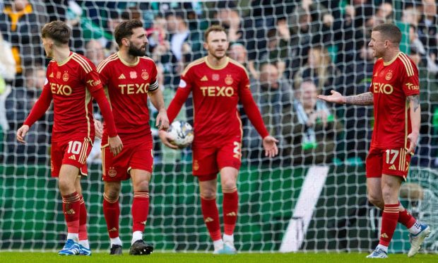 Aberdeen's Graeme Shinnie and Jonny Hayes look dejected after they concede a second goal against Celtic. Image: SNS.
