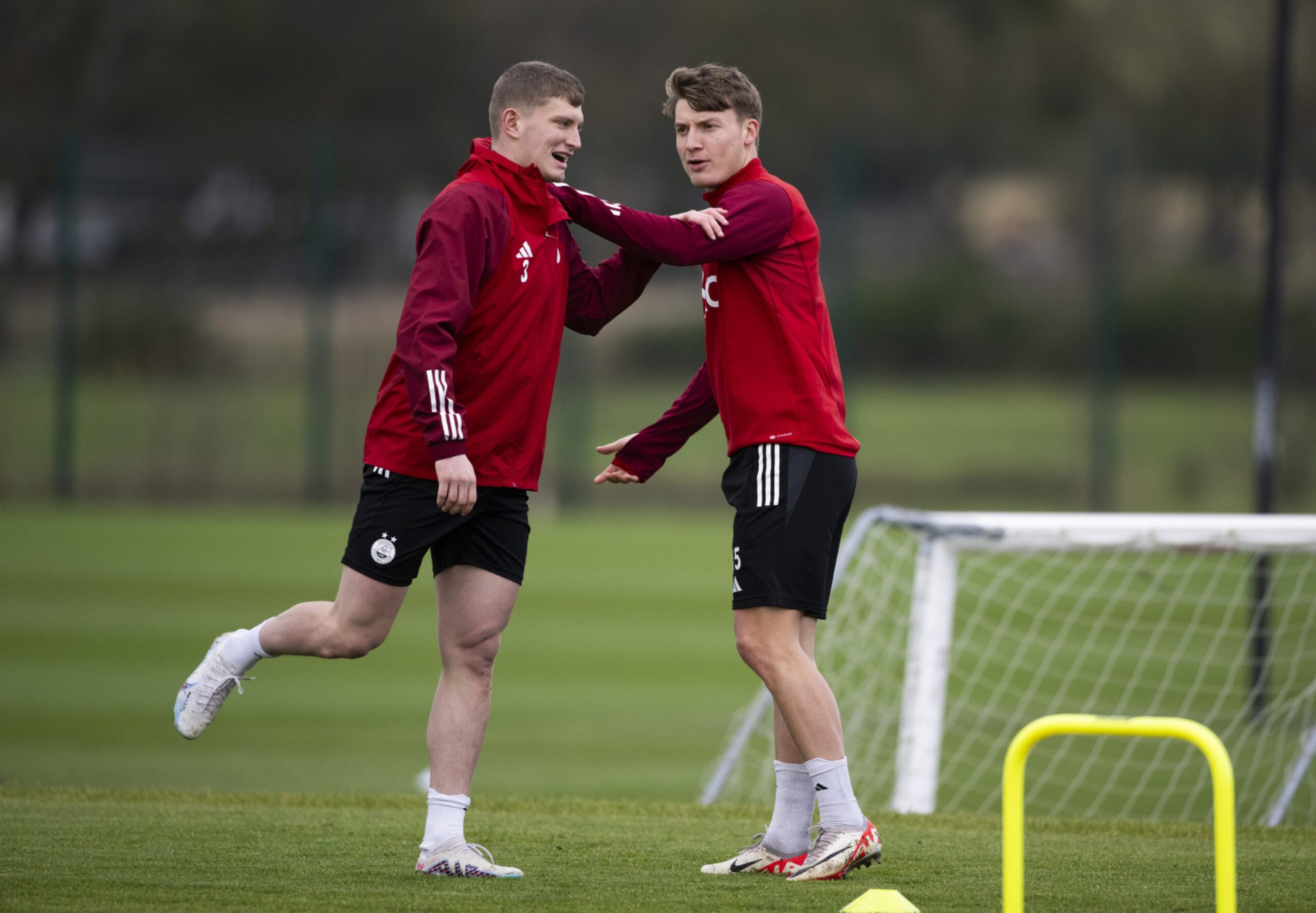 Jack MacKenzie and James McGarry during an Aberdeen training session at Cormack Park. Image: SNS 