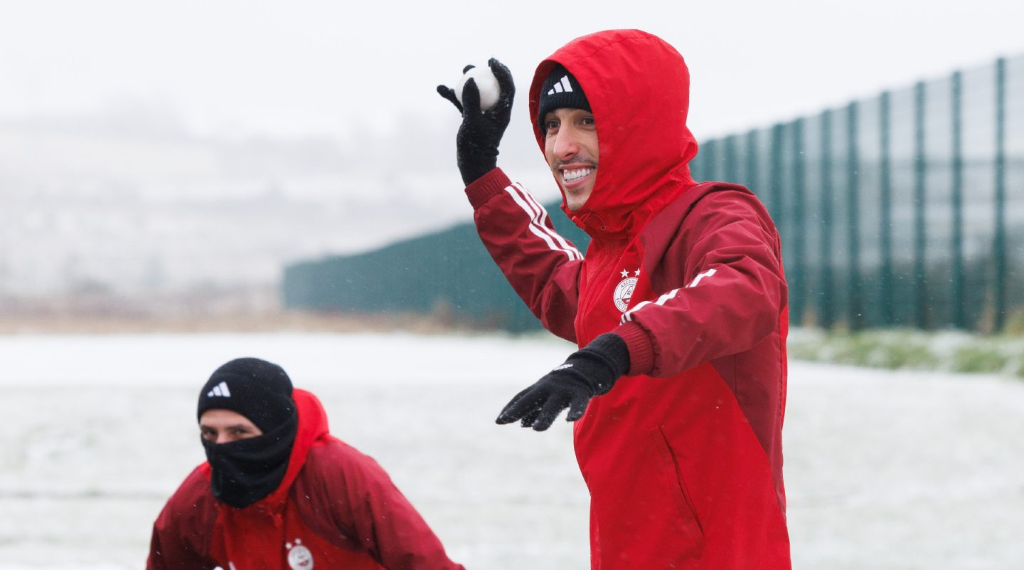 Bojan Miovski about to throw a snowball during an Aberdeen training session