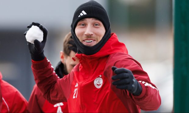 Angus MacDonald up to some mischief during an Aberdeen training session at Cormack Park. Image: SNS.